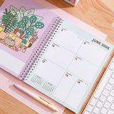 Calendar open to the second week of June 2026. The page spread is plant themed.