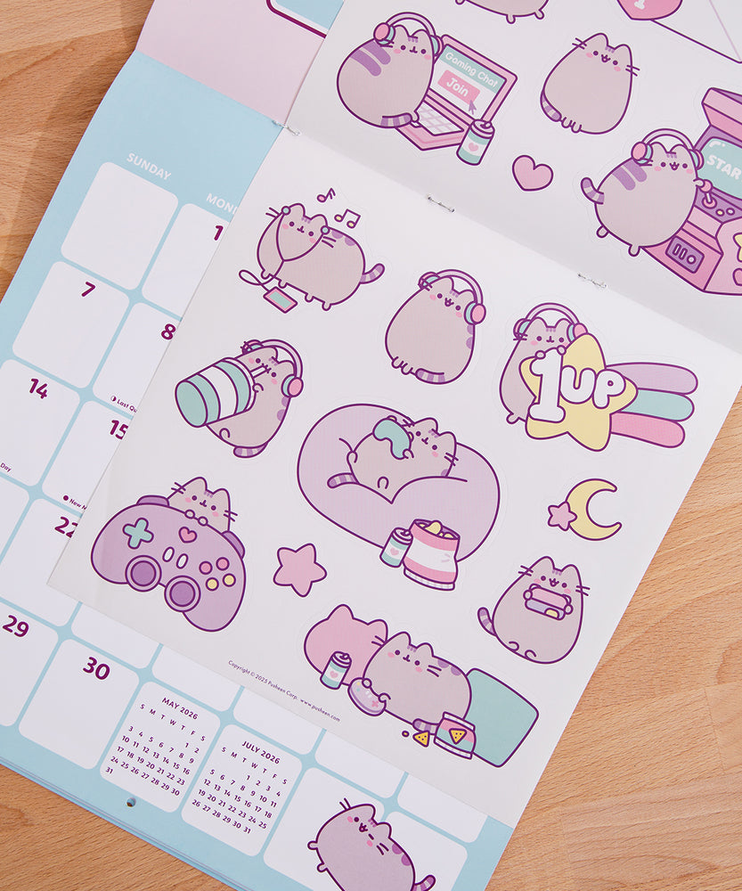 Back cover of the 2026 Pusheen Hanging Wall Calendar. The back covers shows a preview of all the art graphics inside the monthly calendar. 