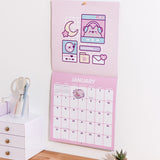 January 2026 spread in the Pusheen Calendar. The top half includes a full page graphics while the bottom half includes a full month calendar view. 