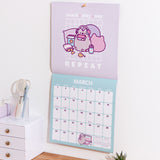 Wall-mounted calendar open to March 2026. The calendar portion includes an overview of the previous month and previews the next month in the bottom right hand corner.