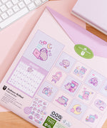 Back cover of the 2026 Pusheen Hanging Wall Calendar. The back covers shows a preview of all the art graphics inside the monthly calendar. 