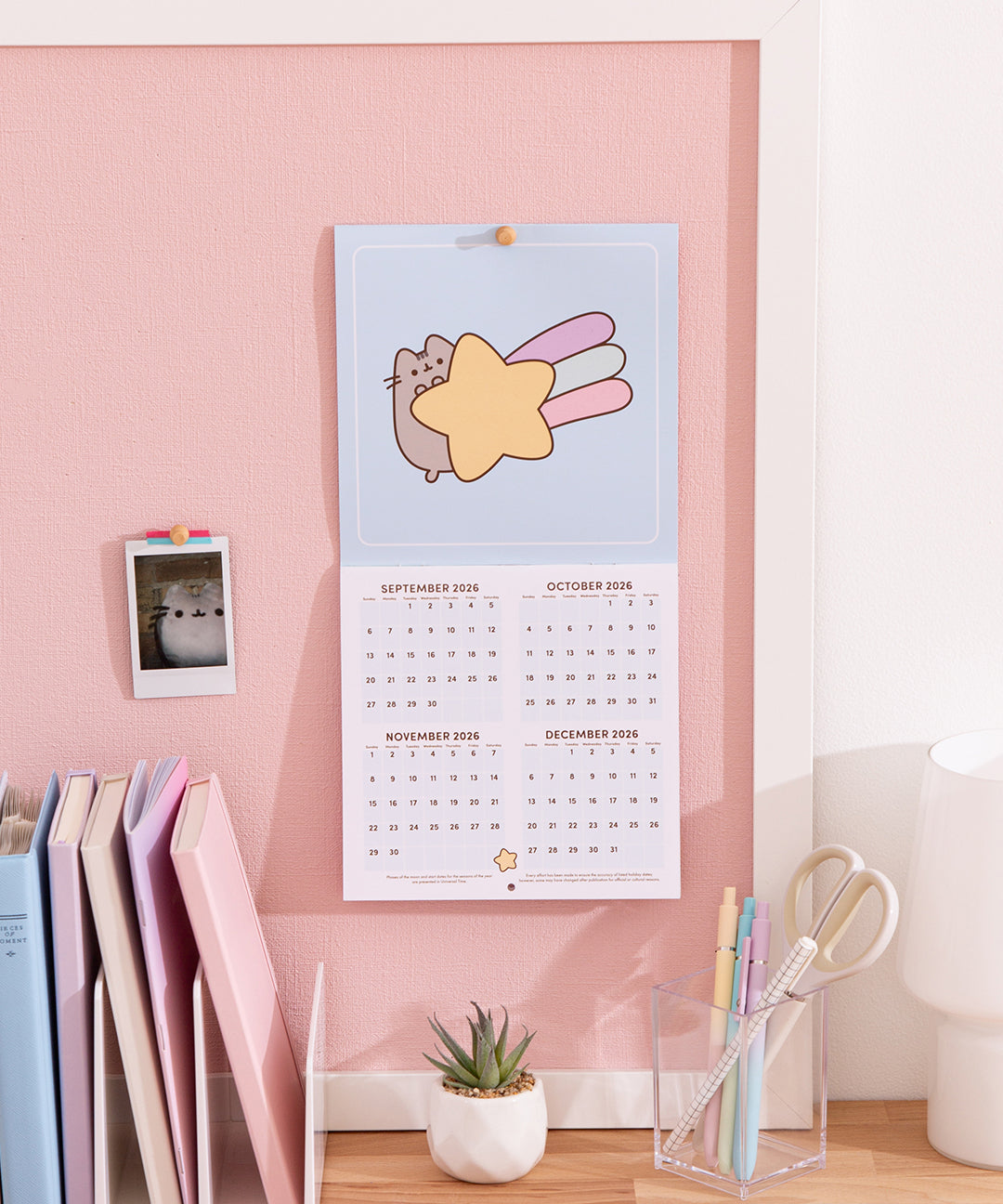 Wall-mounted mini calendar open to planning portion spanning September - December 2026.