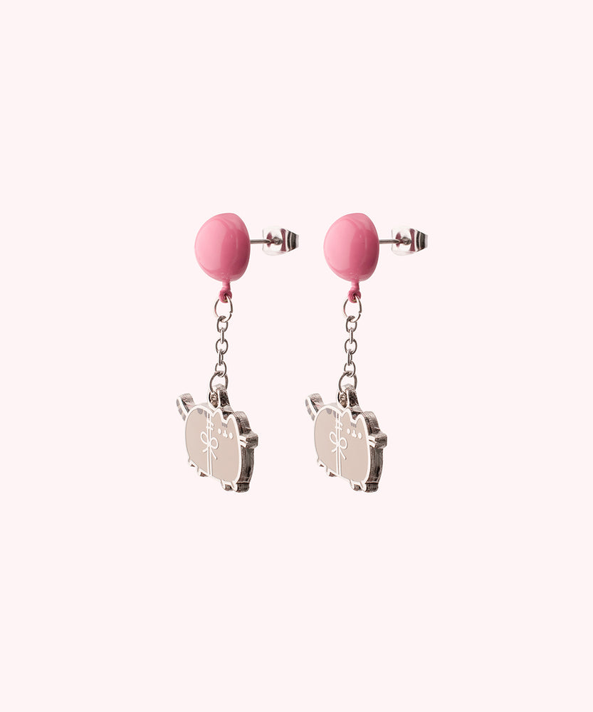 Back view of the Balloon Dangle Earrings on their backer card. The back shows the Pusheen Shop branding and SalesOne manufacturer branding. The backs of the Pusheen earrings can be seen in this view and shows Pusheen logo is shown on the back of the silver earrings.