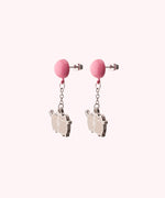 Back view of the Balloon Dangle Earrings on their backer card. The back shows the Pusheen Shop branding and SalesOne manufacturer branding. The backs of the Pusheen earrings can be seen in this view and shows Pusheen logo is shown on the back of the silver earrings.
