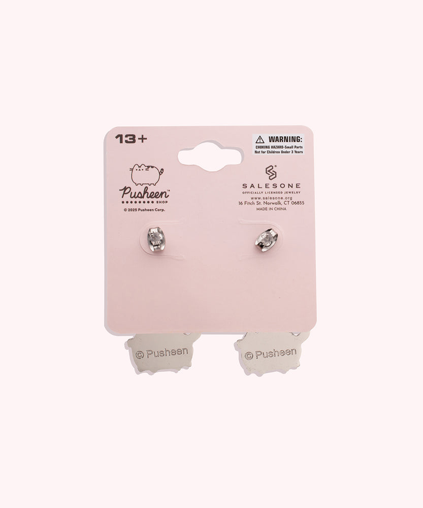 Back view of the Balloon Dangle Earrings on their backer card. The back shows the Pusheen Shop branding and SalesOne manufacturer branding. The backs of the Pusheen earrings can be seen in this view and shows Pusheen logo is shown on the back of the silver earrings.