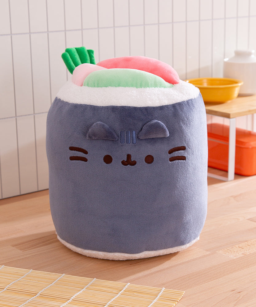 Front view of the Pusheen face that is on one side of the Sushi Roll Plush. The cat's ears are 3D while her face, head stripes, and whiskers are embroidered.