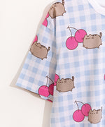 Close-up of drop-sleeve detail on the Cherry Pajama top. The print continues down the sleeve of the blue and white gingham pajama set.