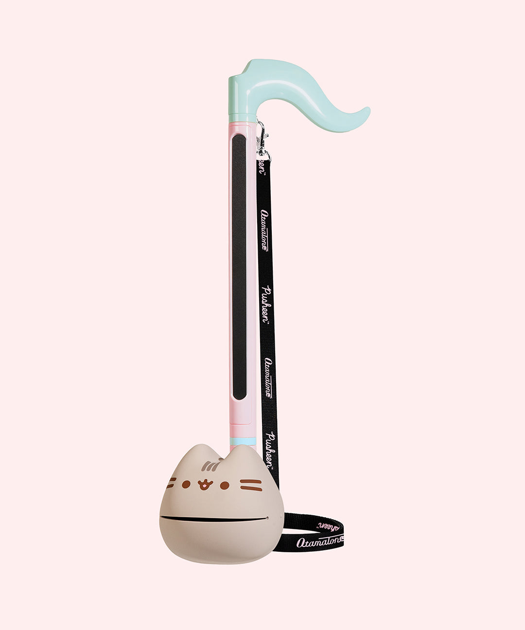 Full view of the Pusheen Deluxe Otamatone. The top is mint green and resembles the top of a musical note. The pink stem leads into a gray rounded bottom.