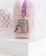 Close-up of the Arcade Pin on the Gaming Accessory Case. Pusheen the Cat holds the pink joystick that is placed on the front of the game. 