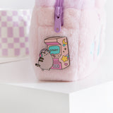 Close-up of the Arcade Pin on the Gaming Accessory Case. Pusheen the Cat holds the pink joystick that is placed on the front of the game. 
