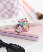 Gamer Arcade pin lies on a desktop. A round gray tabby cat plays an arcade game. 