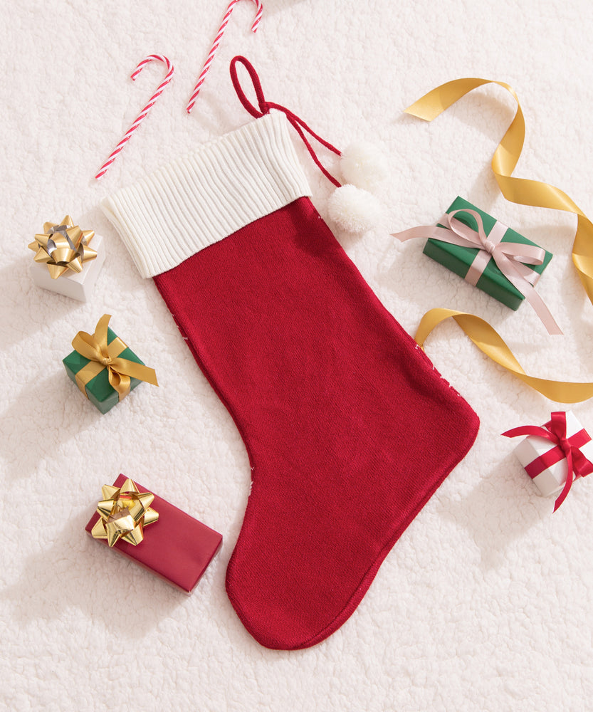 Back view of the Pusheen Knit Stocking that has a fully red knit back with the white ribbing that wraps around the back.