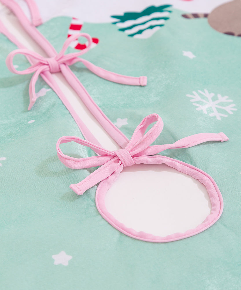 Close-up of the three included pink ties on the tree skirt to ensure the circle remains closed.