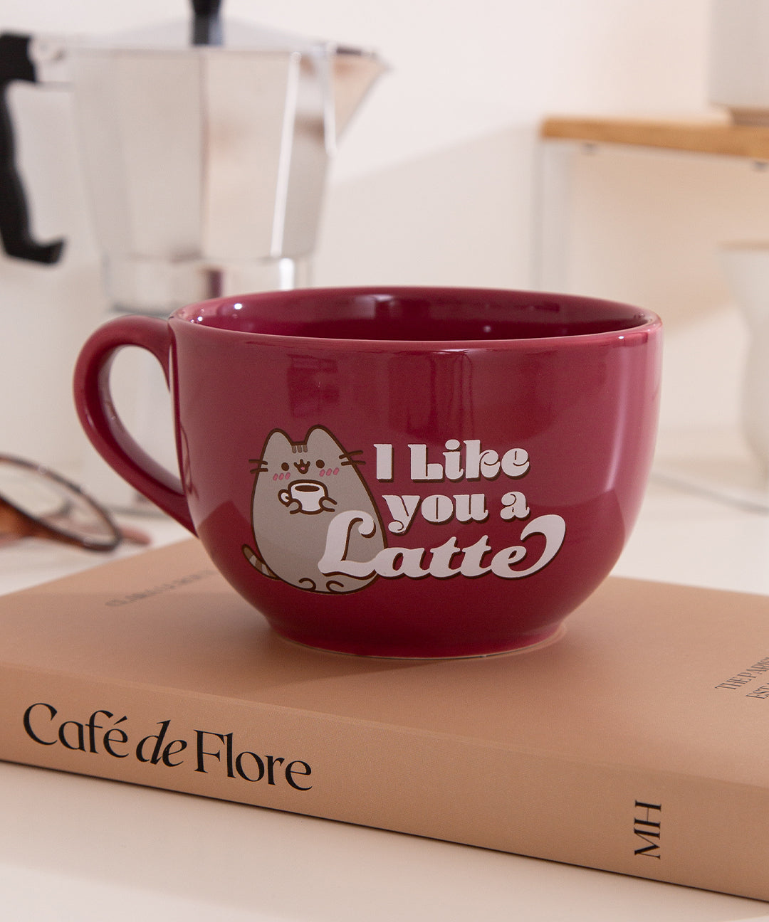 Close-up of the Pusheen latte mug showing the phrase "I Like you a Latte" in white next to the graphic of the gray tabby cat.