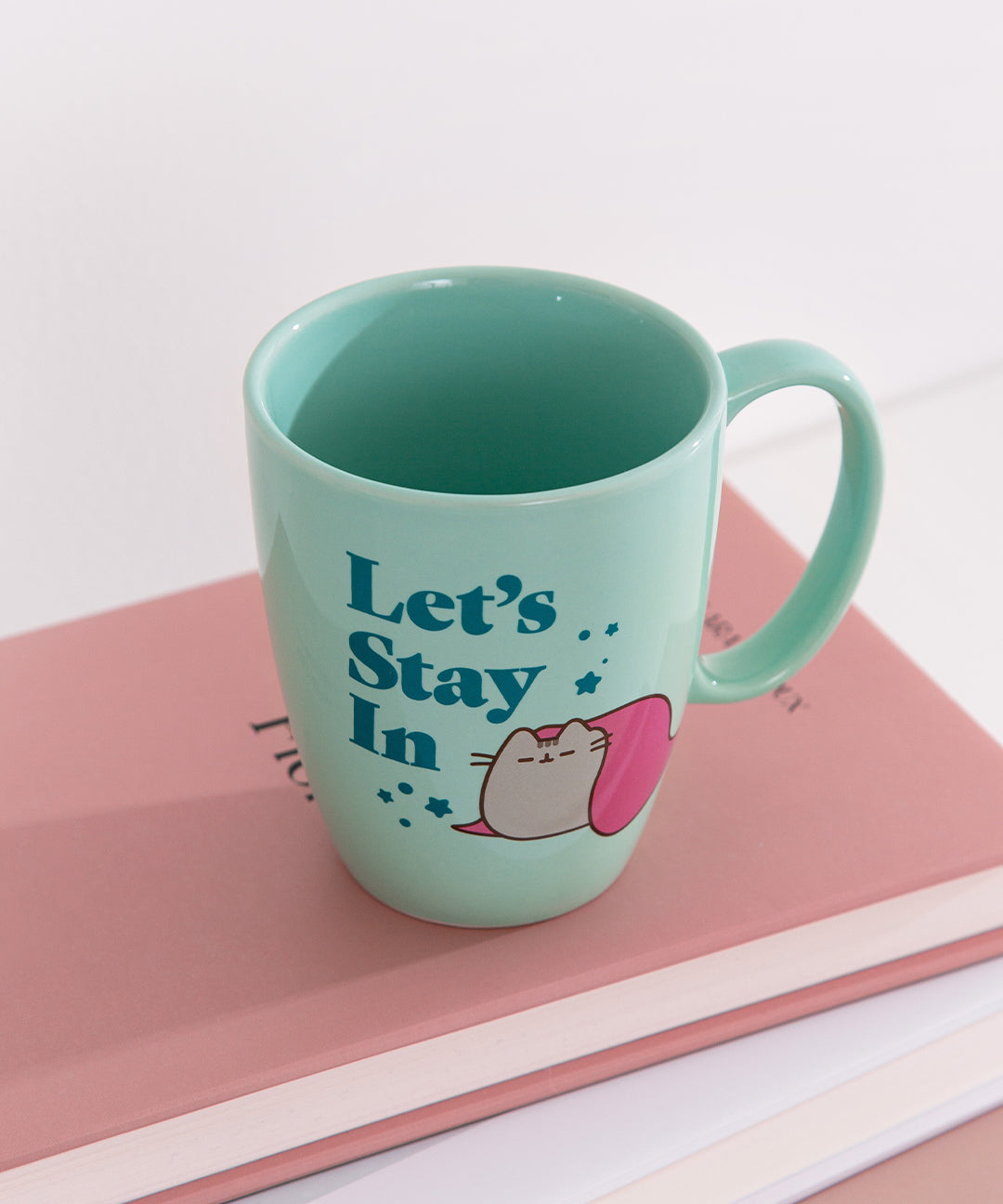 Interior view of the green Pusheen mug shows that the interior color of the mug matches the outside light green color.