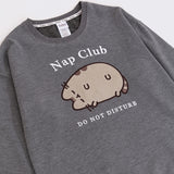 Gray sweatshirt with a sleeping grey cat. Surrounding the cat is the text "Nap Club" and "Do Not Disturb"