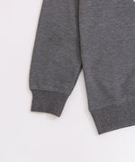 Close-up view of the ribbed hem and cuffs on the Pusheen Nap Club Loungewear Top.