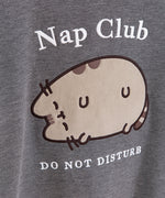 Close-upf of flocked treatment on the Nap Club Pusheen Sweatshirt. The gray cat is shown with brown details and outlined in black.