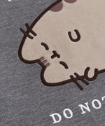 Close-up of the flocked material on the Sweatshirt. The gray cat is flocked while her details are embroidered.
