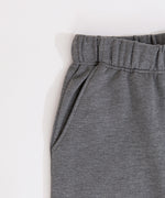 Close-up of the stretch waistband and side pocket on the pants of the heather gray Nap Club Loungewear Set.