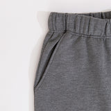 Close-up of the stretch waistband and side pocket on the pants of the heather gray Nap Club Loungewear Set.