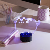 Pusheen Otaku Lamp on a desktop. The acrylic lamp is shown in a purple color.