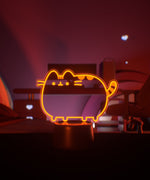Orange LED lamp shaped light a standing cat.