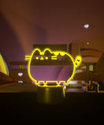 Yellow LED lamp shaped light a standing cat.