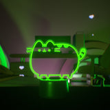 Neon green cat-shaped light on a dark background