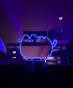 Purple Otaku Lamp of Pusheen the Cat sits on desktop.
