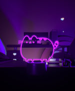 Pink Pusheen the Cat character light on a dark background