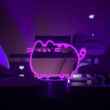 Pink Pusheen the Cat character light on a dark background