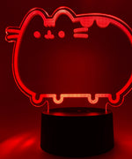 Close-up of the acrylic plate on the Pusheen Otaku Lamp. The lamp is set to the color red.