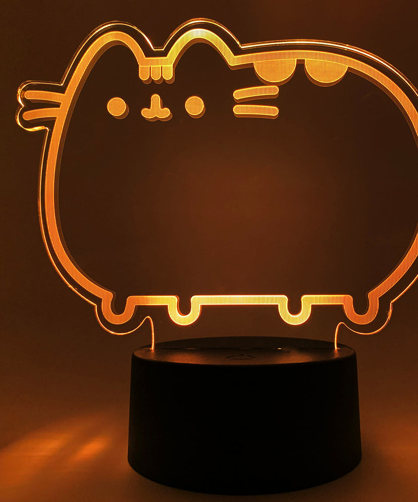 Close-up of the acrylic plate on the Pusheen Otaku Lamp. The lamp is set to the color orange.