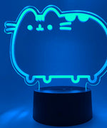 Close-up of the acrylic plate on the Pusheen Otaku Lamp. The lamp is set to the color blue.