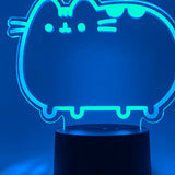Close-up of the acrylic plate on the Pusheen Otaku Lamp. The lamp is set to the color blue.