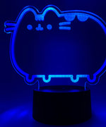 Close-up of the acrylic plate on the Pusheen Otaku Lamp. The lamp is set to the color dark blue.