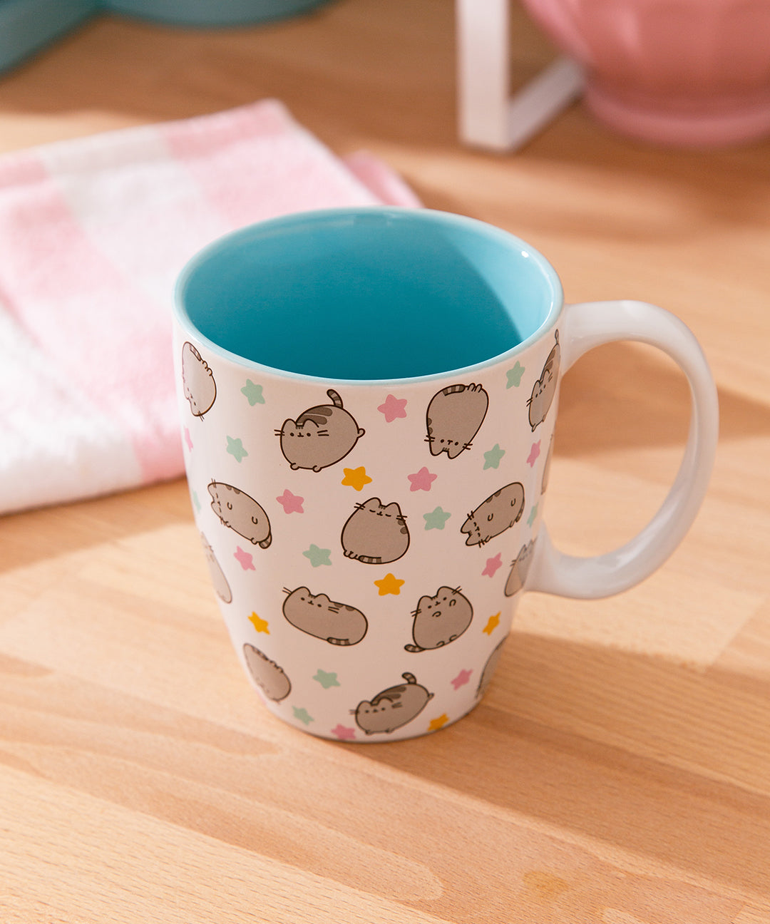 Interior view of the white Pusheen mug shows that the interior color of the mug is a light blue color.