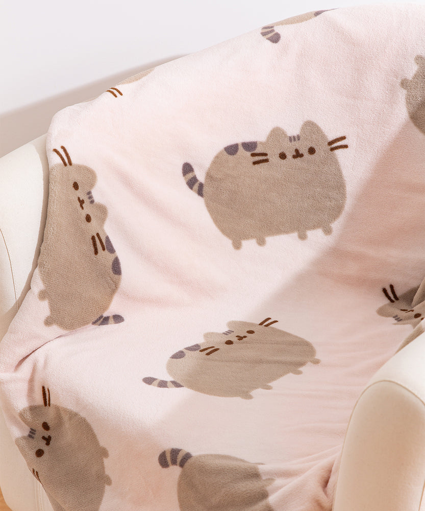Close-up of cat pattern on the Pusheen Plush blanket.
