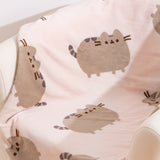 Close-up of cat pattern on the Pusheen Plush blanket.