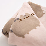 Close-up of Pusheen print on the Pusheen Patterned Plush Blanket. The cat is shown in light grey with dark gray stripes and brown facial features.
