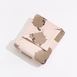 Plush blanket with Pusheen all-over pattern folded in a rectangle.