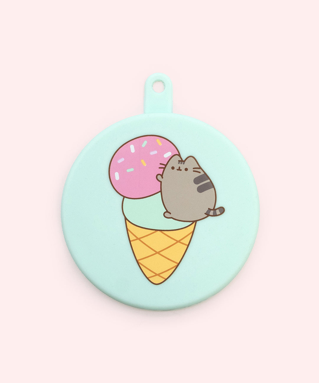 Close-up of the mint green pet food silicone can cover. On the front of cover is a graphic of a gray tabby cat climbing a two-tiered ice cream cone.