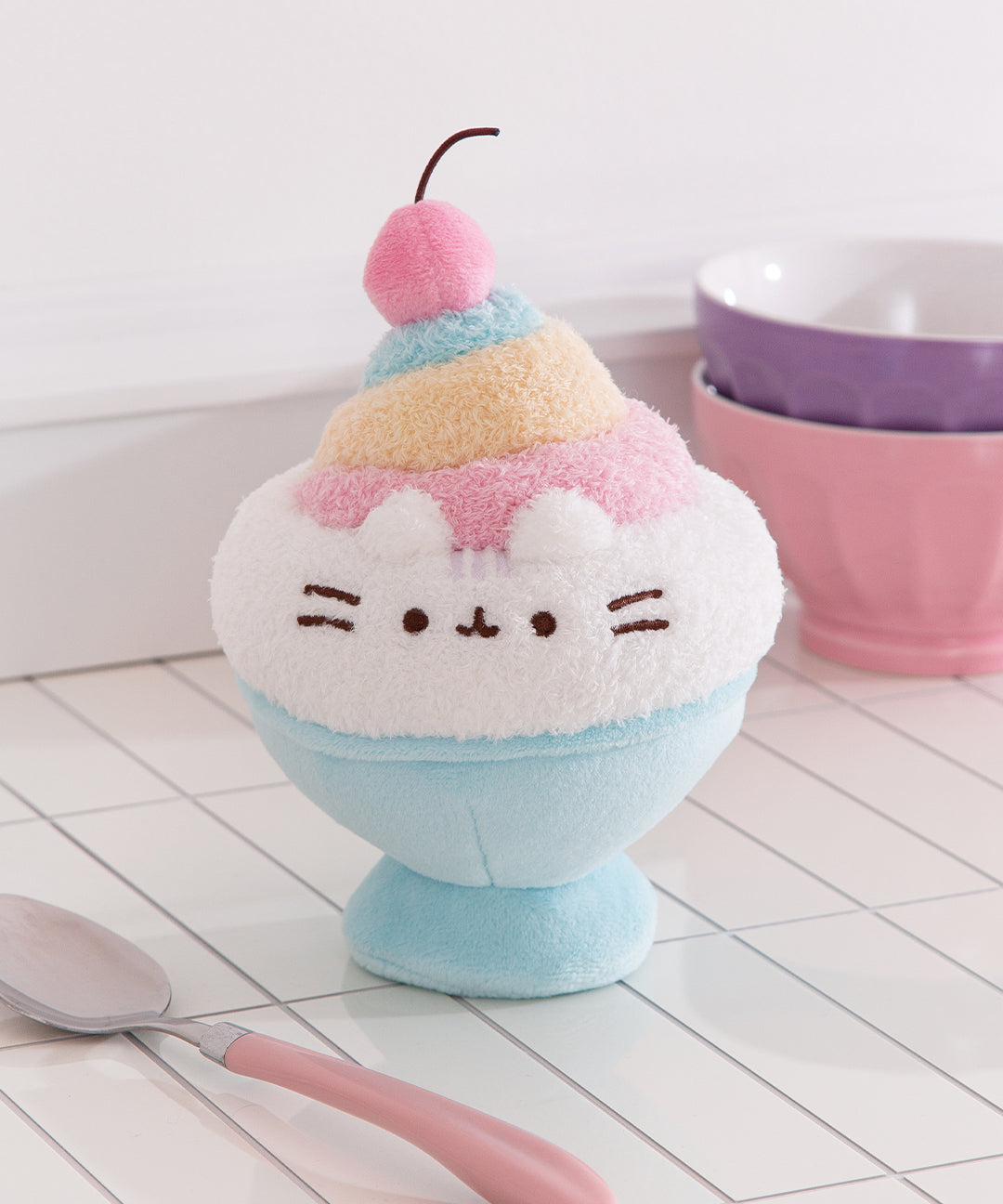 Pusheen Shaved Ice Plush stands up and features a swirl of colorful shaved ice topped with a cherry.