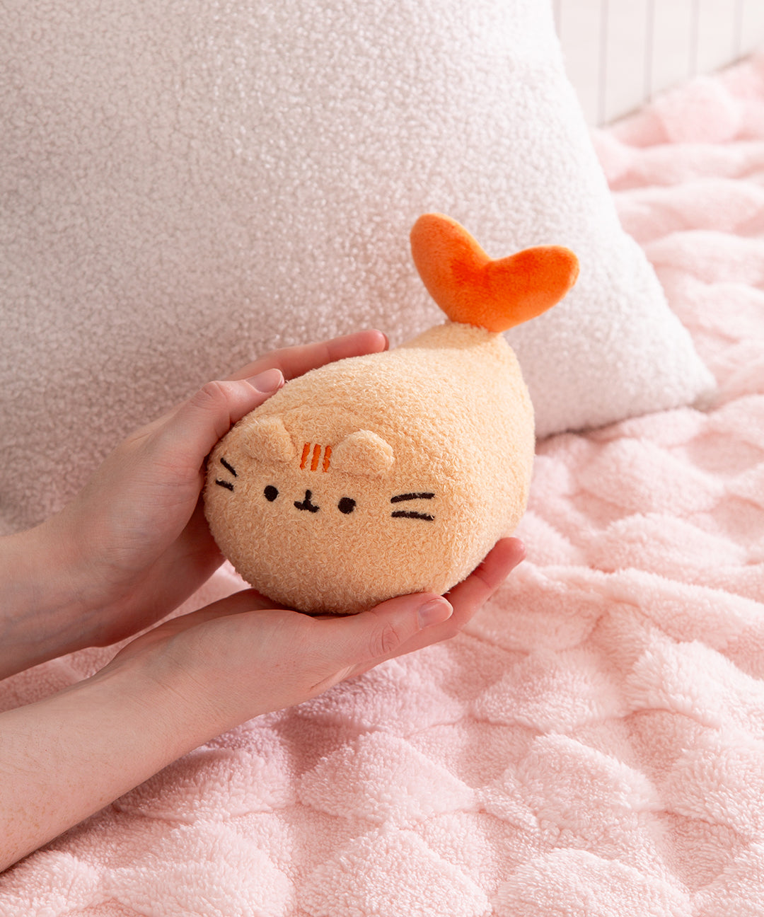 Model holds the shrimp tempura Pusheen plush to showcase the size and scale of textured plush.