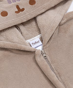Close-up of a zipper and Pusheen Shop tag on the Pusheen Kigurumi.
