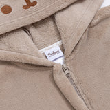 Close-up of a zipper and Pusheen Shop tag on the Pusheen Kigurumi.