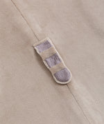 Close-up of Pusheen's grey and brown striped plush tail on the kigurumi onesie.
