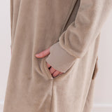 Model wearing Pusheen Toe Beans Kigurumi with hand in side pocket.