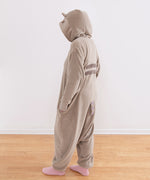 Model wearing onesie facing the wall to show the two back stripes and striped tail.